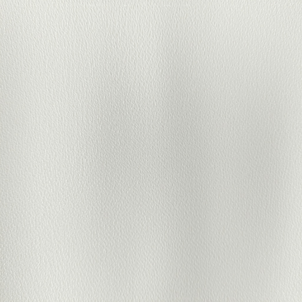 Close-up of nano-coated wool fabric demonstrating water and stain resistance